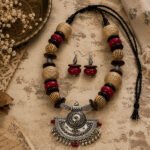 Tribal Grace Necklace Set with antique silver pendant, wooden beads, jute accents, and matching earrings, handcrafted boho ethnic jewelry for women.