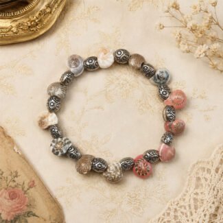 Vintage snail shell bracelet with patterned shell beads and antique oxidised silver beads.