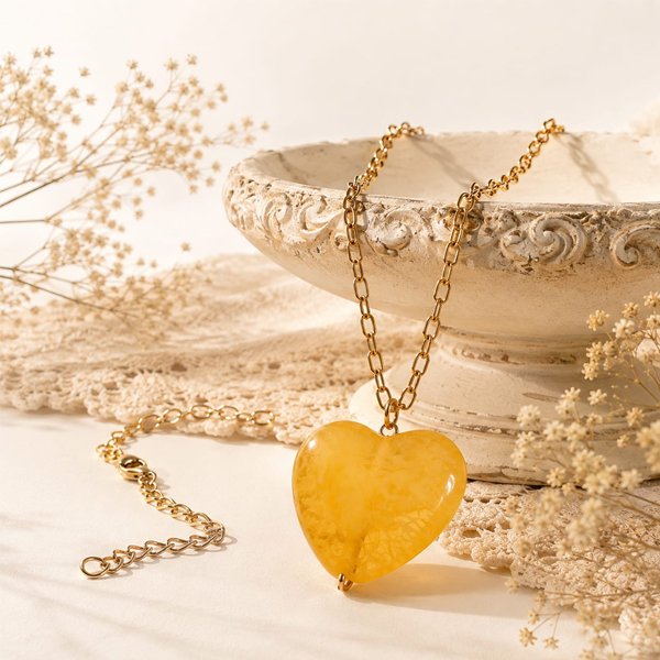 Golden-Heart-Pendant Golden Heart Pendant with a glossy yellow chemical bead and golden oxidised chain.