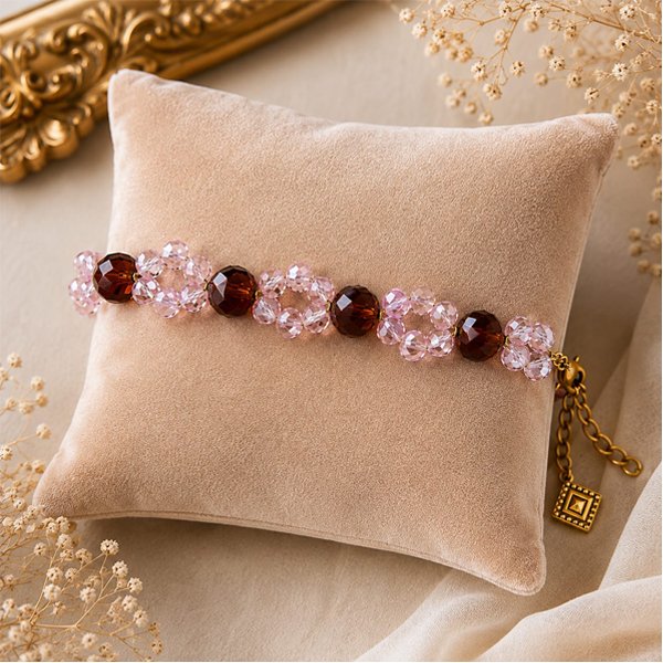 Pink-Bloom-bracelet Pink Bloom handmade bracelet with pink crystal flower beads, brown faceted crystal beads, golden chain, and diamond-shaped charm.