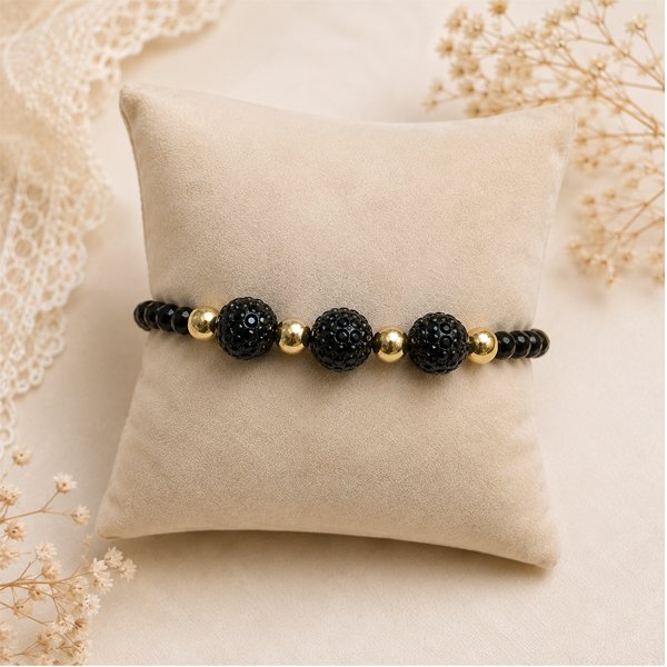 Midnight-Charm-Bracelet Handmade Midnight Charm Bracelet with black rhinestone beads, golden oxidised accents, and sparkling crystal beads.