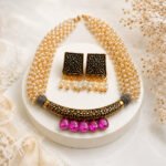 Mughal Bloom long necklace set with gold oxidised floral pendant, pink rhinestones, and layered gold pearl strands.