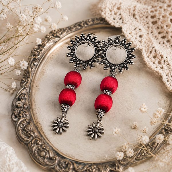 Antique-Blossom-Earrings Antique Blossom oxidised earrings with red silk-thread beads and silver floral charms.