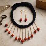 Minimalist Rudraksha choker set with a golden chain and black cotton tassel. Elegant and versatile jewelry suitable for sarees, kurtis, or western outfits.