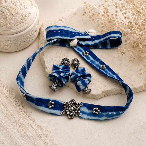 Handmade Indigo Petal Statement Cloth Choker featuring blue hand-dyed fabric with an oxidised floral centerpiece, perfect for boho and ethnic wear.